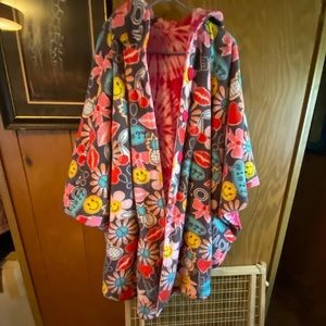 Reversible coat-like cape with hood